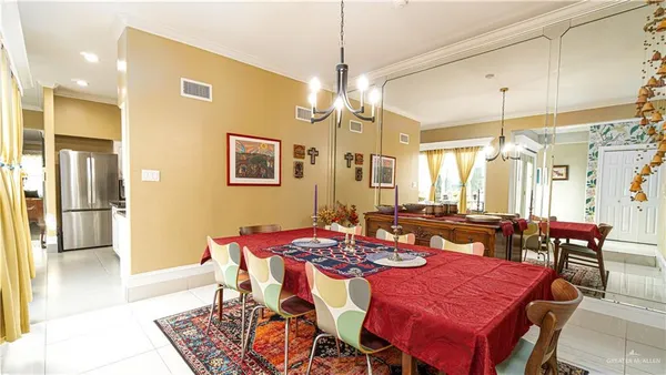 a dining room with furniture and window