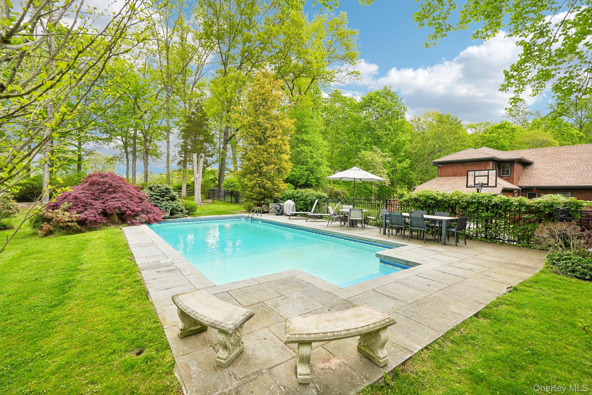 27 Cat Ridge Road North Salem, NY 10560 - Photo 8 of 49 a view of a swimming pool with lounge chair