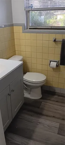 a bathroom with a toilet and a sink