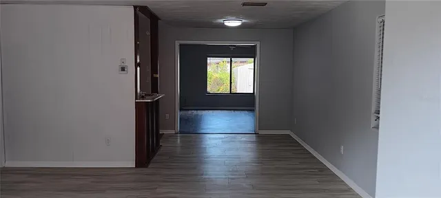 a view of gallery with wooden floor