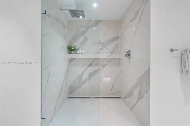 a bathroom with a bathtub and shower