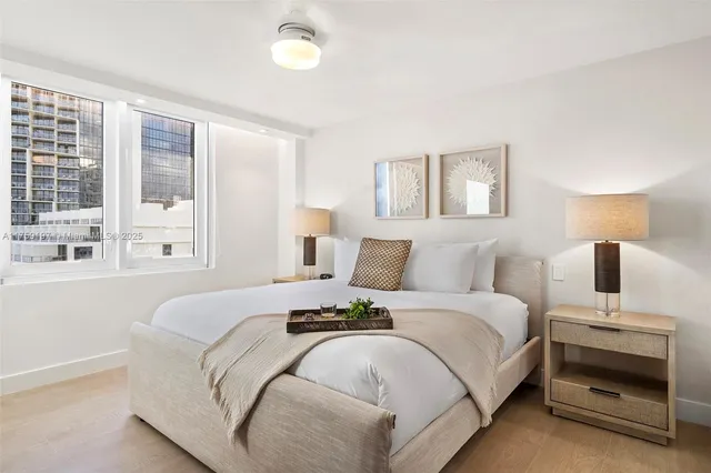 a bedroom with a bed and walk in closet