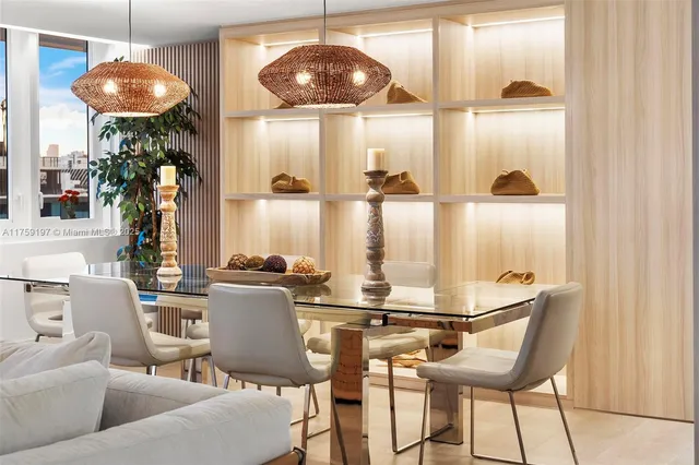 a kitchen with a dining table and chairs