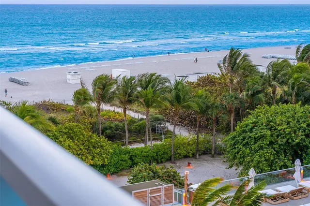 a view of a balcony and dining area