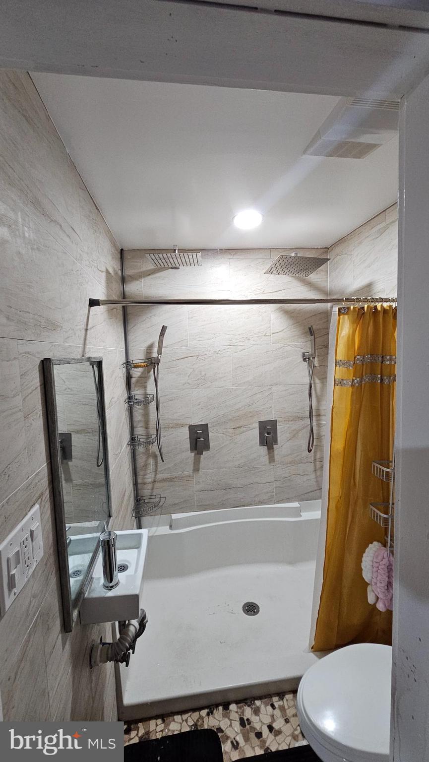 4254 O Street Philadelphia, PA 19124 - Photo 11 of 29 a bathroom with a sink toilet and shower