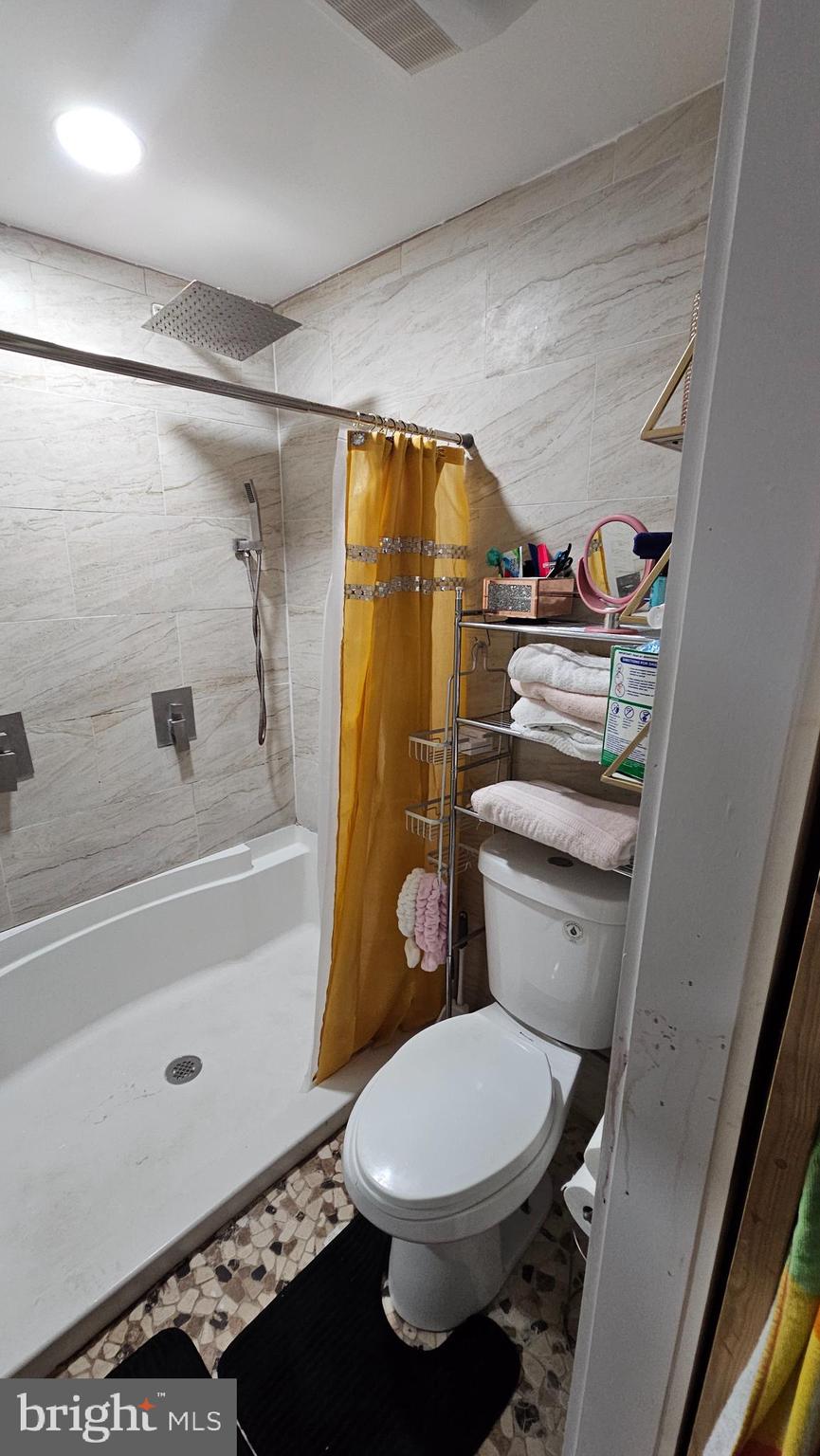 4254 O Street Philadelphia, PA 19124 - Photo 12 of 29 a bathroom with a toilet and a shower