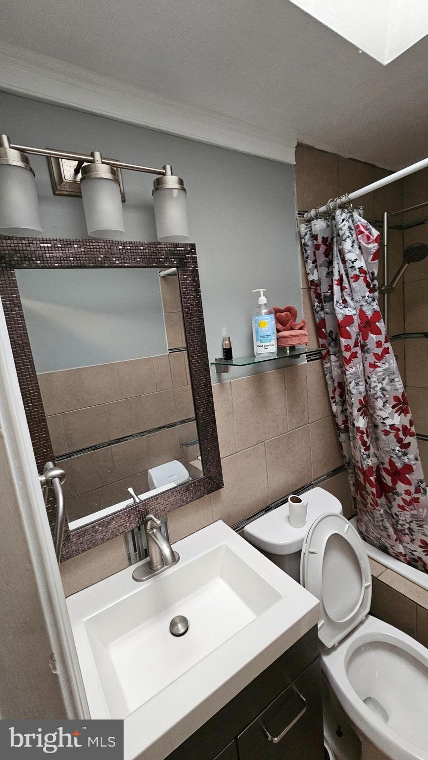 4254 O Street Philadelphia, PA 19124 - Photo 20 of 29 a bathroom with a sink and mirror