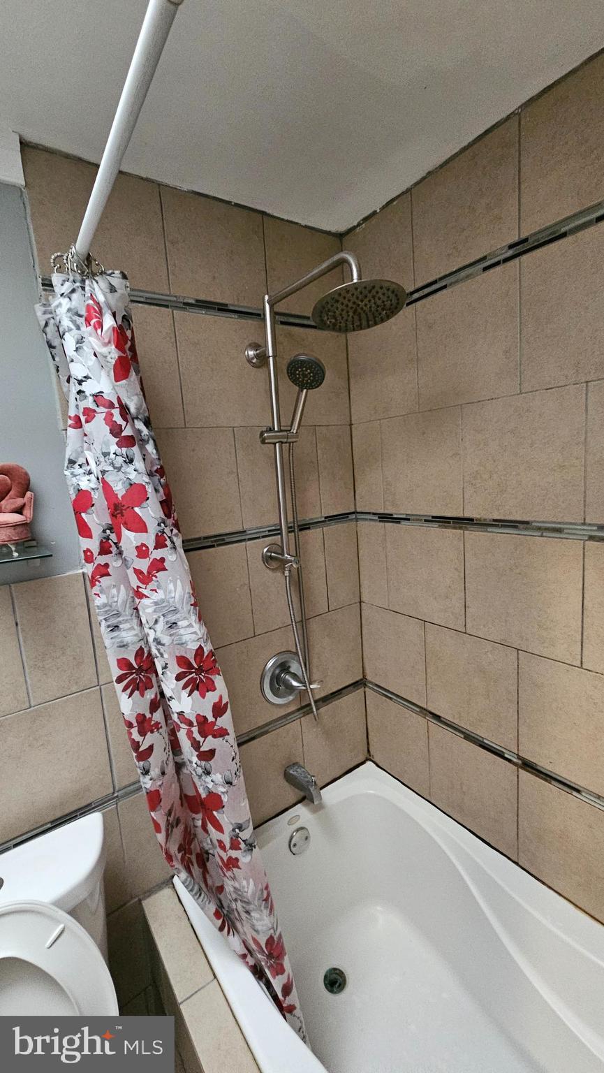 4254 O Street Philadelphia, PA 19124 - Photo 21 of 29 a bathroom with a bathtub and shower