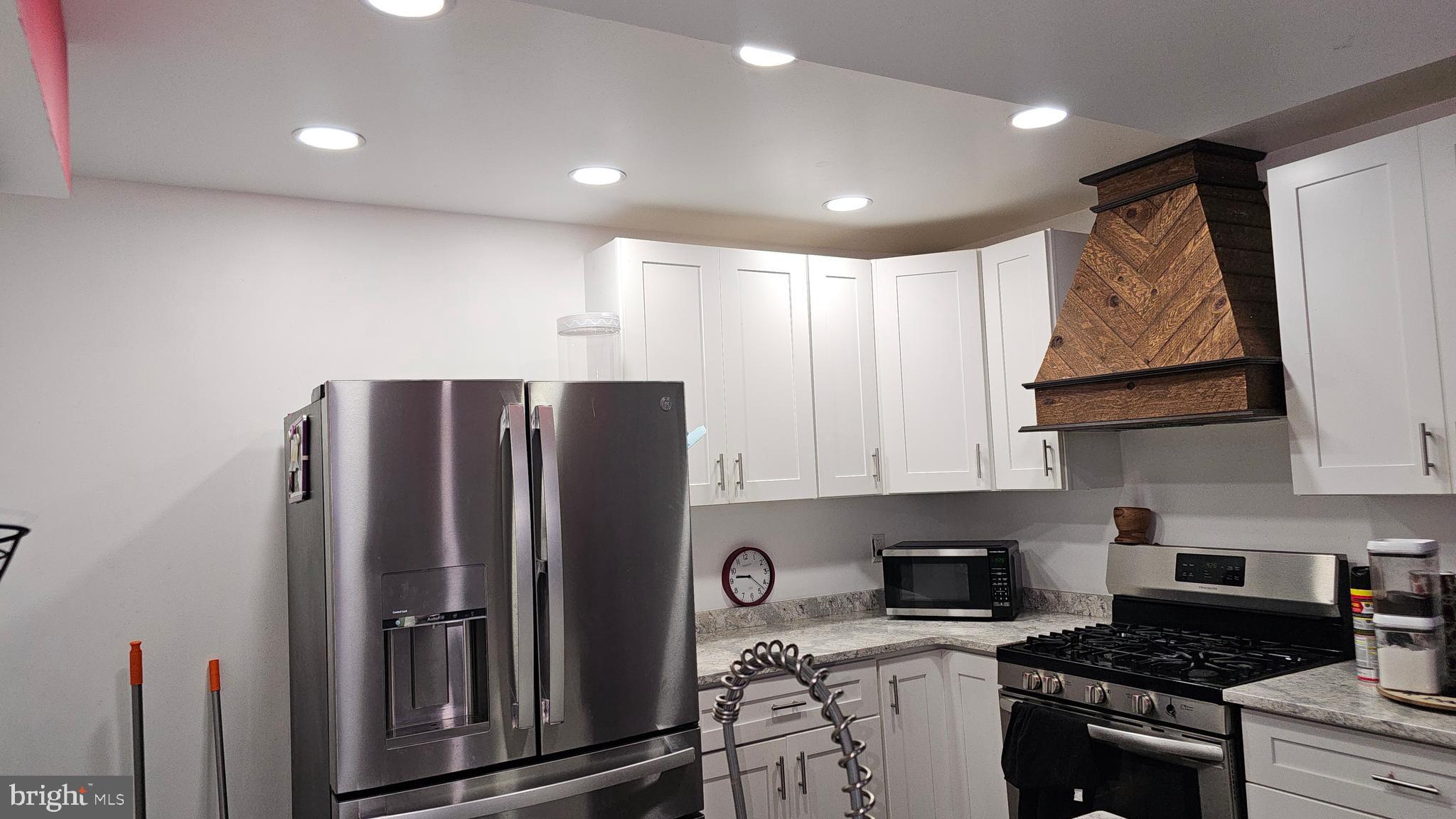4254 O Street Philadelphia, PA 19124 - Photo 27 of 29 a kitchen with stainless steel appliances granite countertop a refrigerator stove and sink