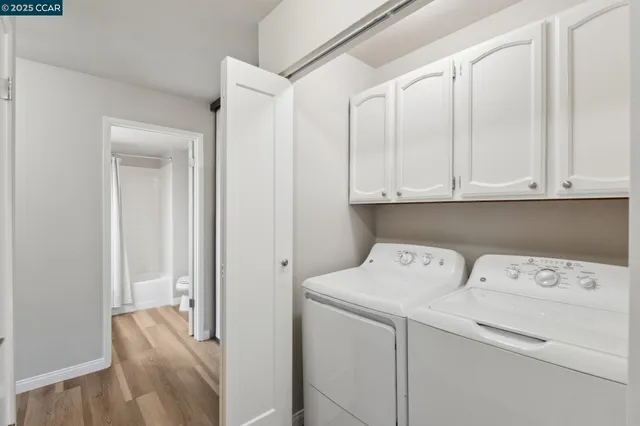 a view of storage and utility room with washer and dryer