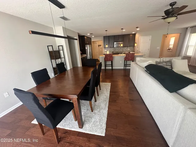 a view of a dining room with furniture