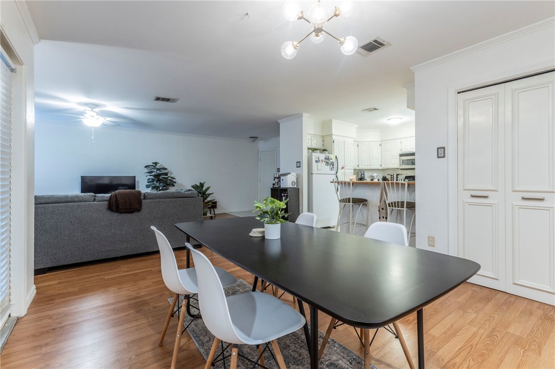 2307 Melissa Drive Waco, TX 76708 - Photo 11 of 23 a dining room with furniture and wooden floor