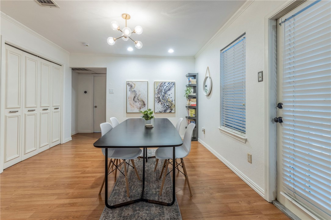 2307 Melissa Drive Waco, TX 76708 - Photo 9 of 23 a view of a room with furniture and wooden floor
