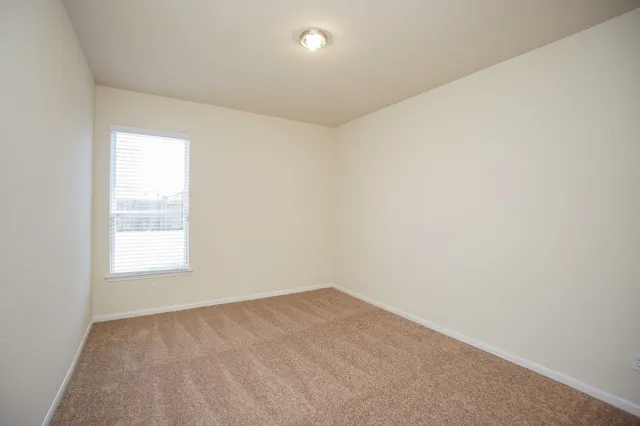 a bathroom with a bathtub shower sink mirror and toilet