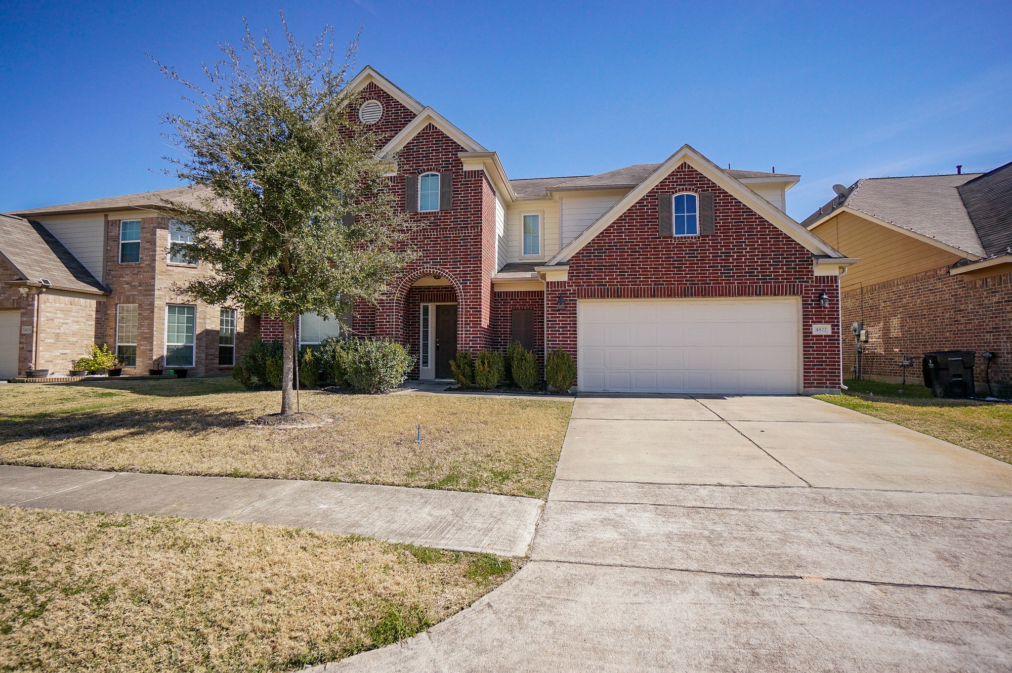 4822 Gingham Check Court Katy, TX 77449 - Photo 2 of 30 a front view of a house with a yard and garage