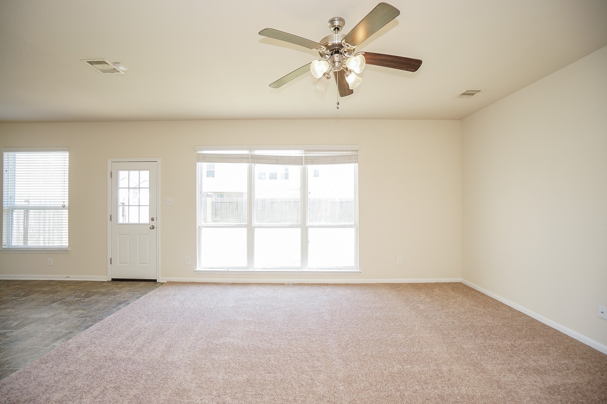 4822 Gingham Check Court Katy, TX 77449 - Photo 9 of 30 an empty room with a empty space and a ceiling fan