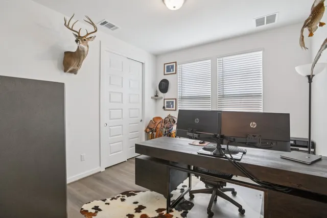 a view of a workspace with furniture