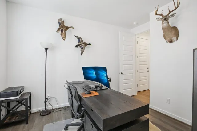 a workspace with furniture and wooden floor