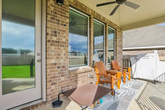a balcony with chairs and outdoor view