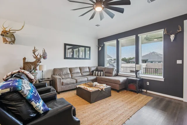 a living room with furniture and a large window
