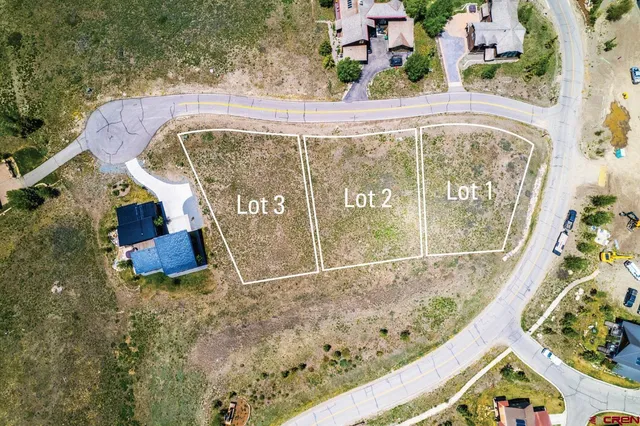 a view of a swimming pool with a yard