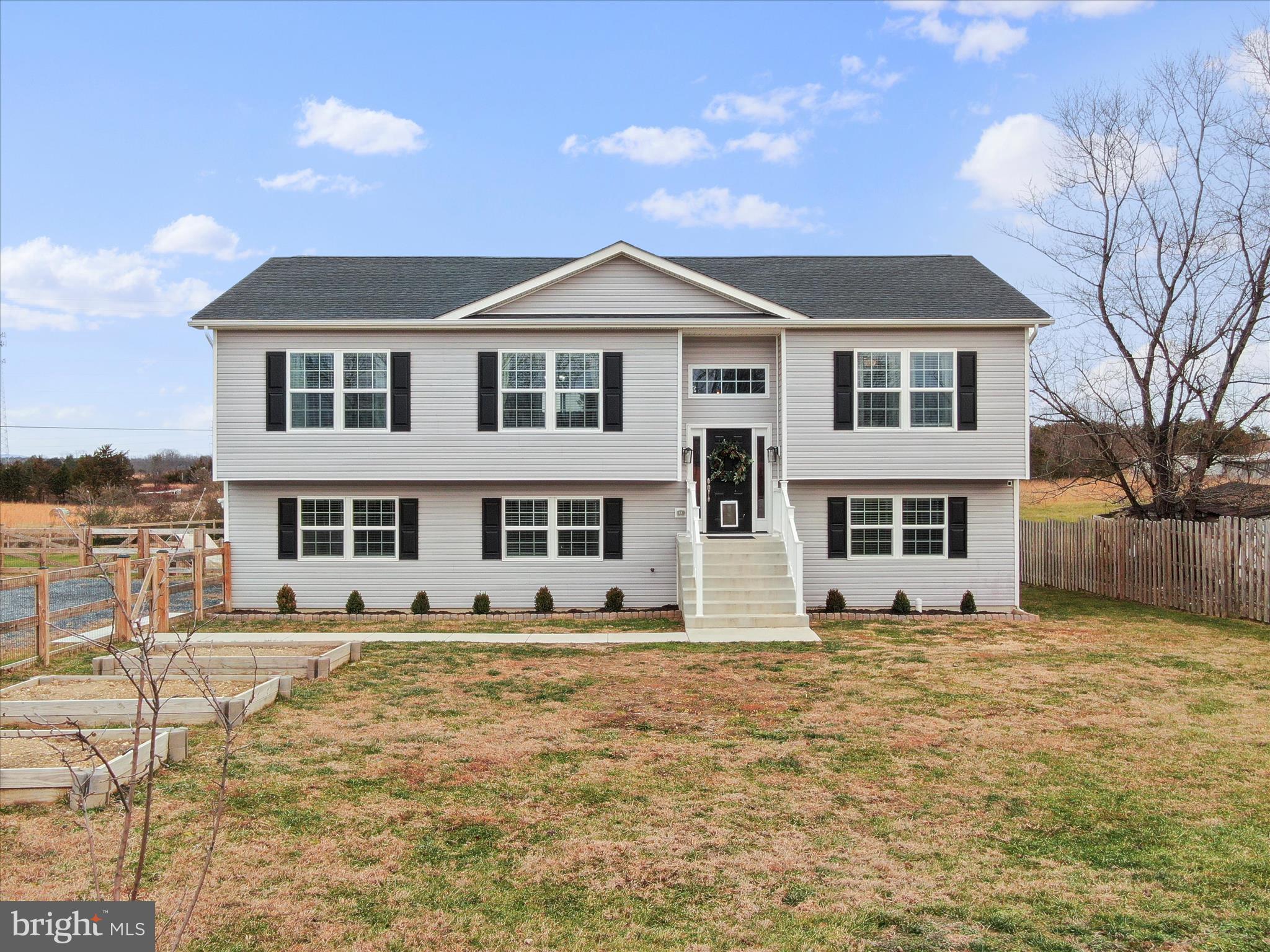 1885 Giles Mill Road Inwood, WV 25428 - Photo 2 of 40 a front view of a house with a yard