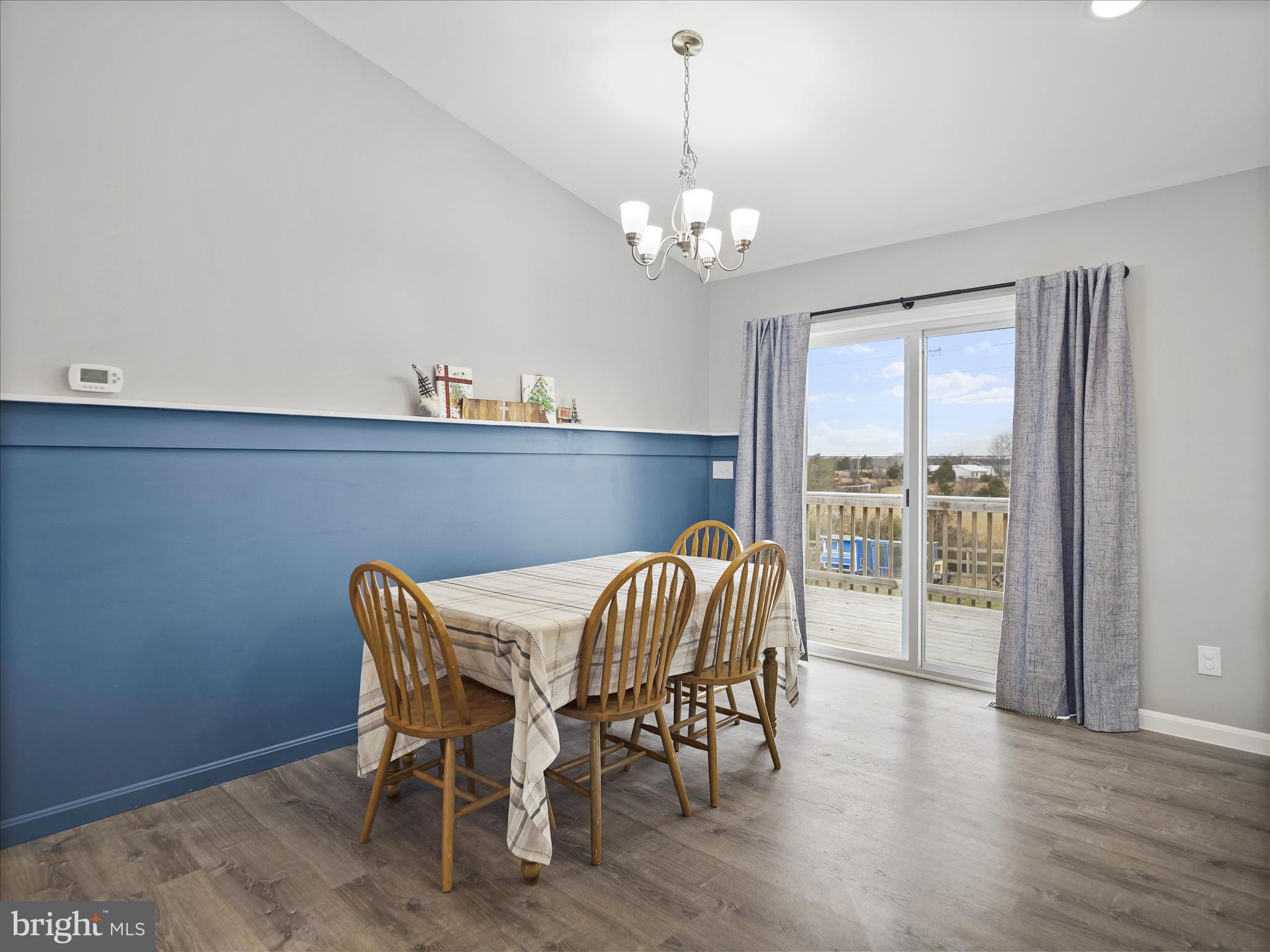 1885 Giles Mill Road Inwood, WV 25428 - Photo 22 of 40 a view of a dining room with furniture wooden floor and chandelier