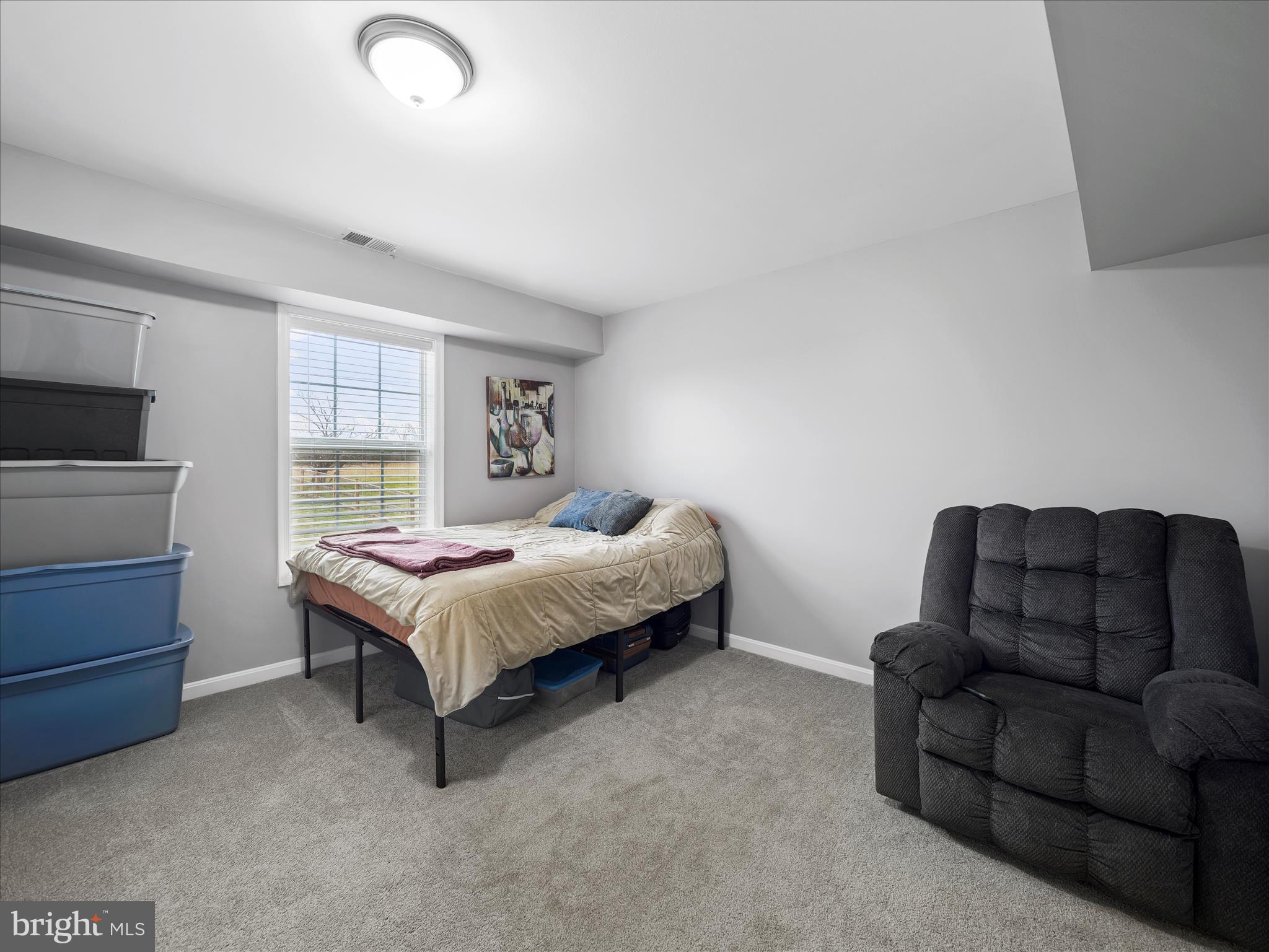 1885 Giles Mill Road Inwood, WV 25428 - Photo 27 of 40 a bed room with a bed and a couch