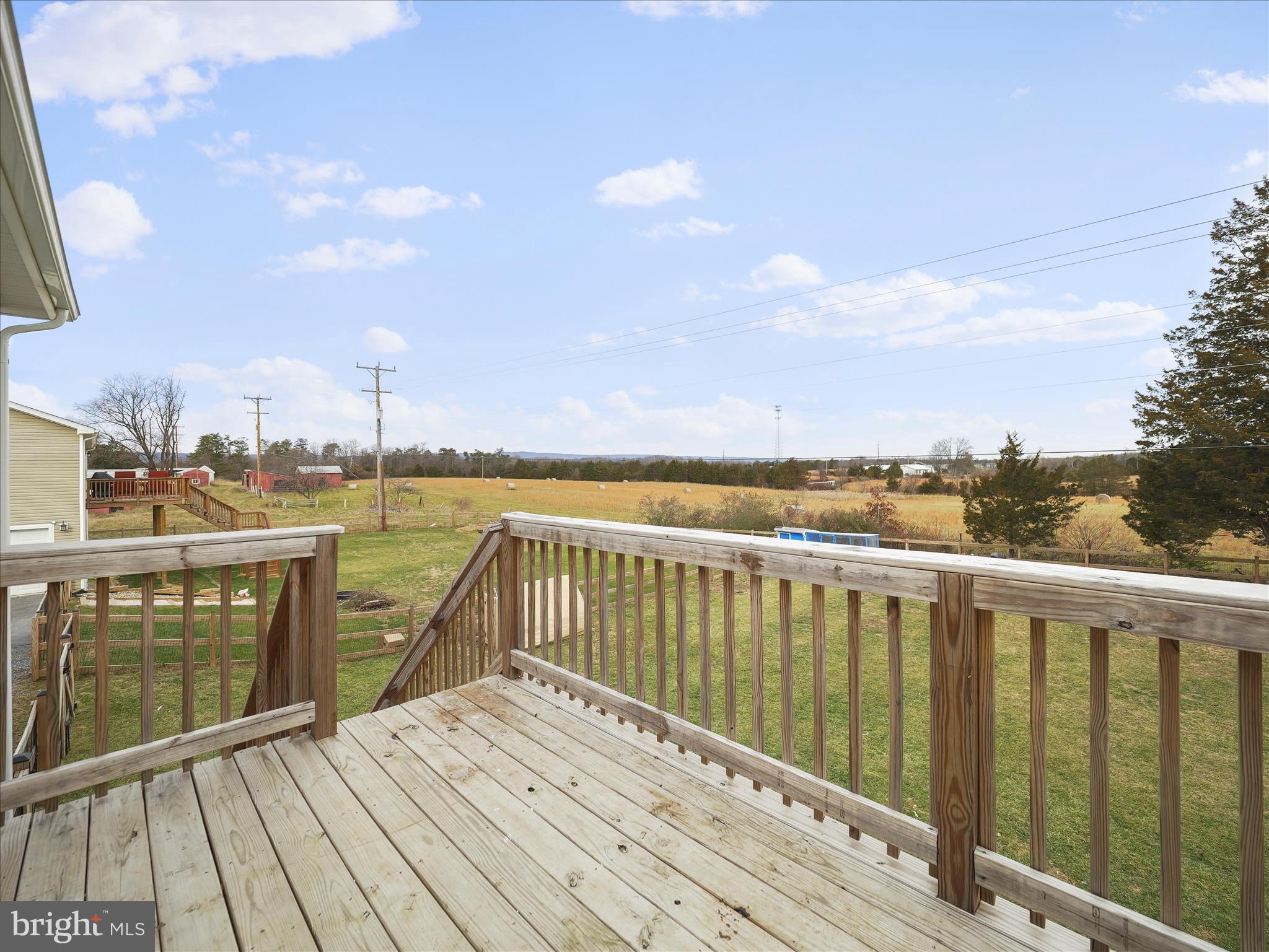 1885 Giles Mill Road Inwood, WV 25428 - Photo 39 of 40 a view of roof deck with two chairs and wooden floor