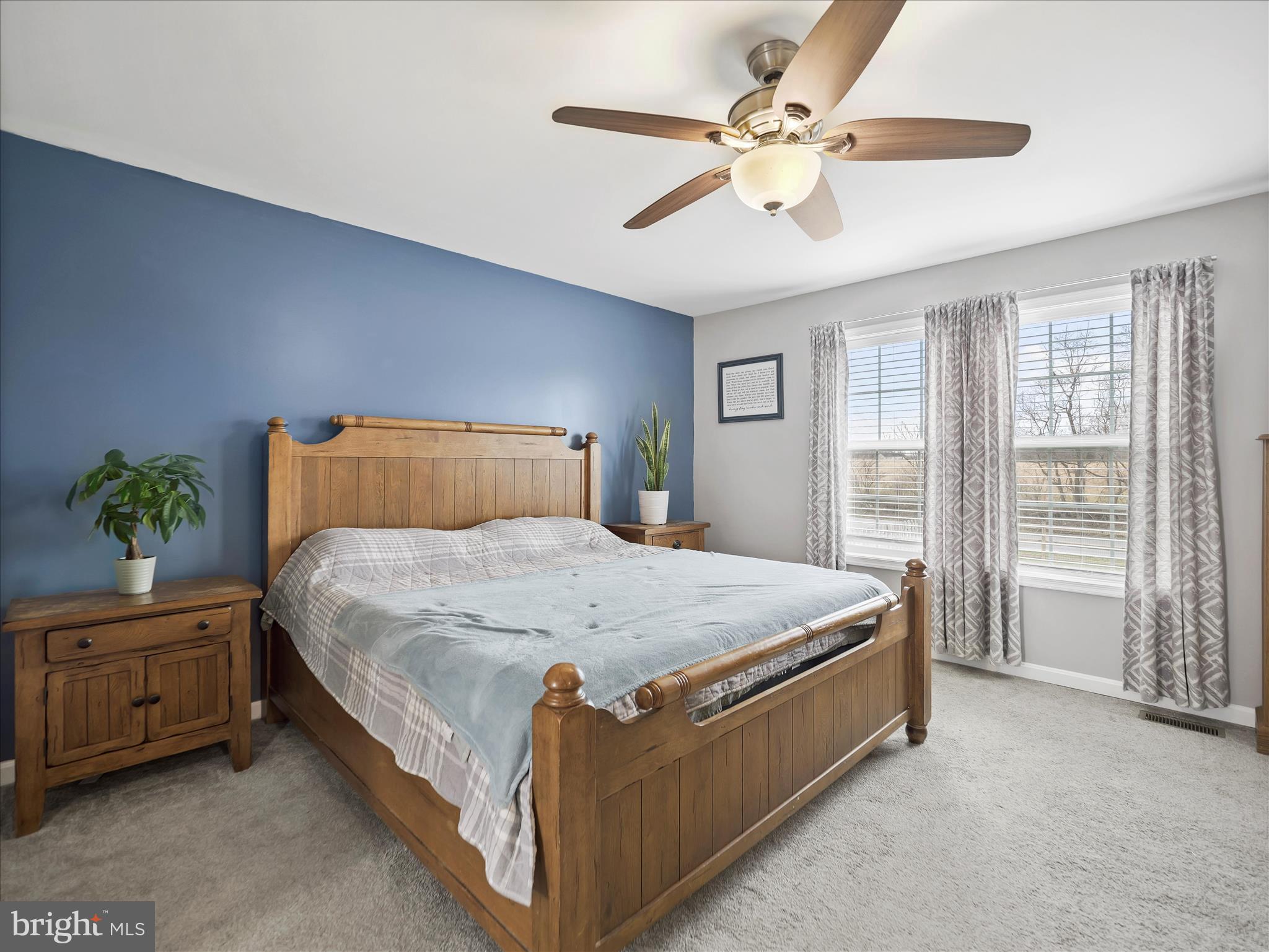 1885 Giles Mill Road Inwood, WV 25428 - Photo 5 of 40 a bedroom with a bed and a chandelier fan