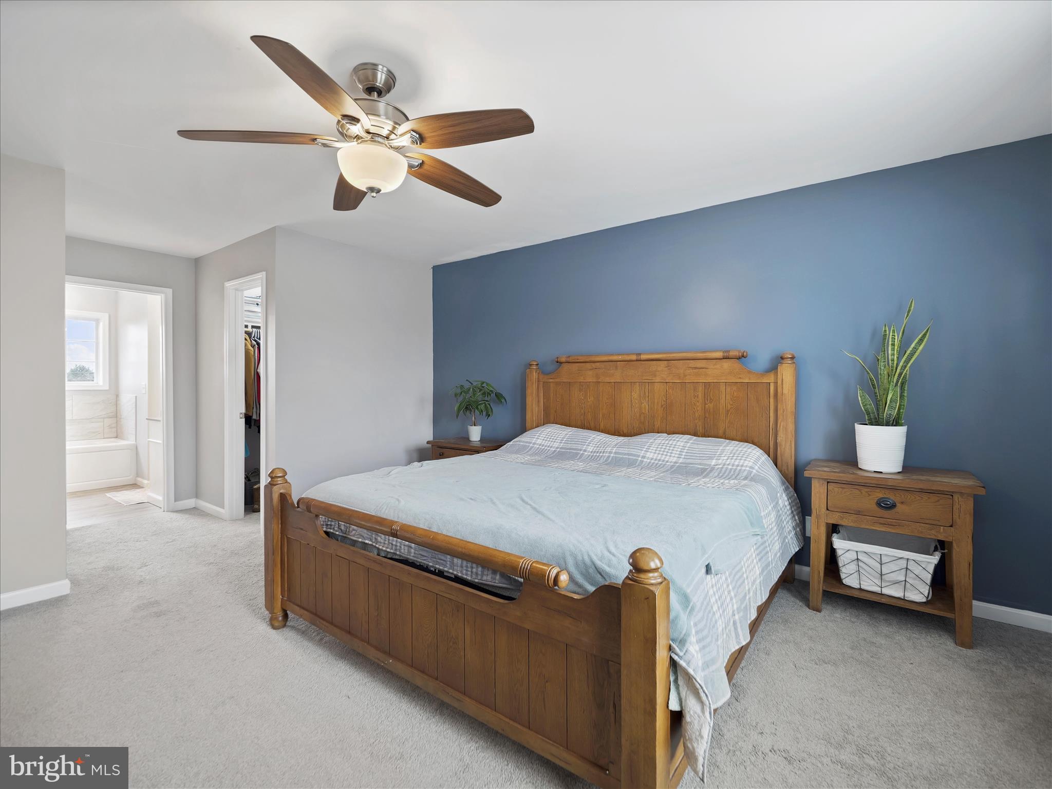 1885 Giles Mill Road Inwood, WV 25428 - Photo 6 of 40 a bedroom with a bed and a ceiling fan