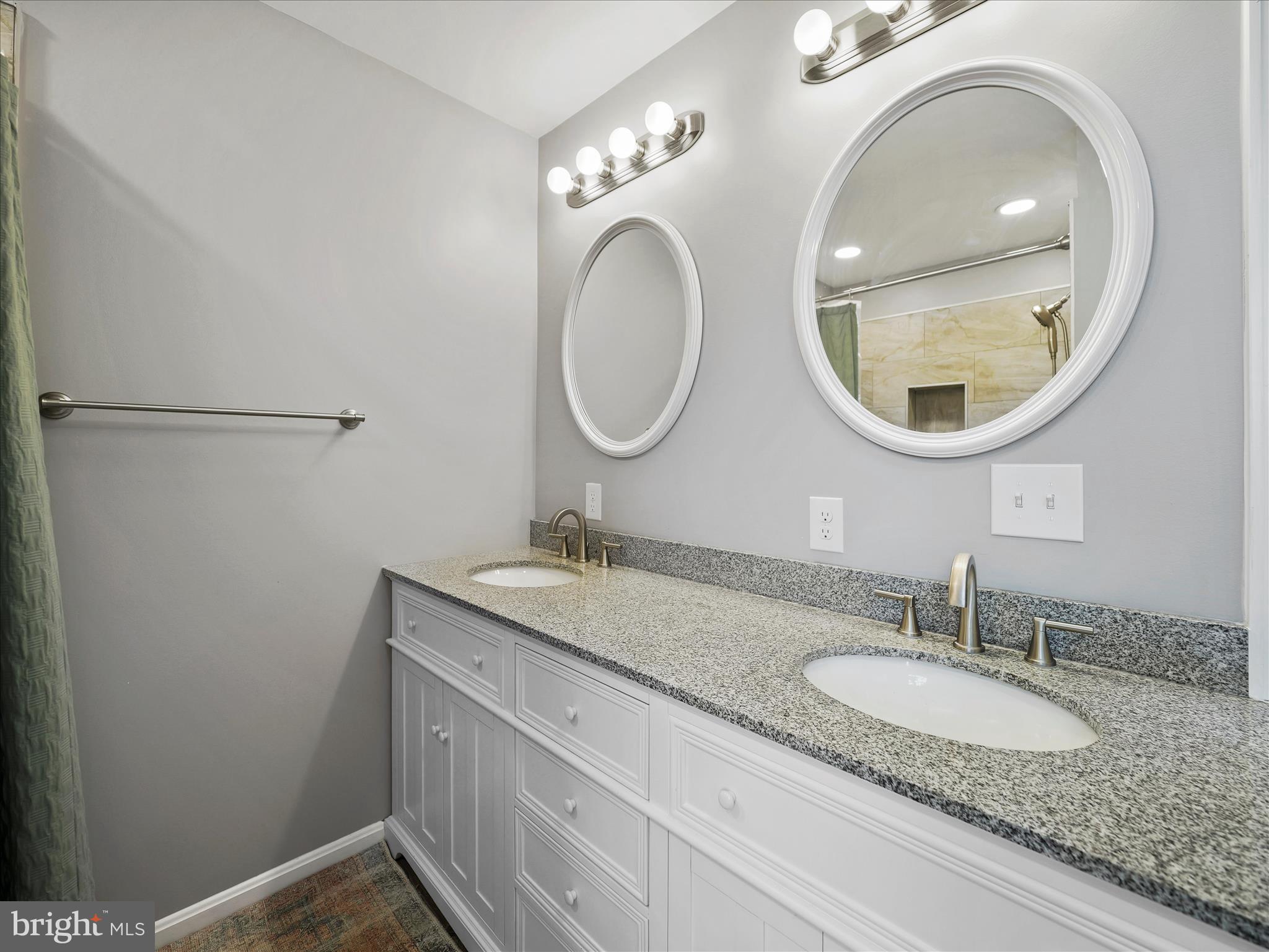 1885 Giles Mill Road Inwood, WV 25428 - Photo 10 of 40 a bathroom with a granite countertop double vanity sink and a mirror
