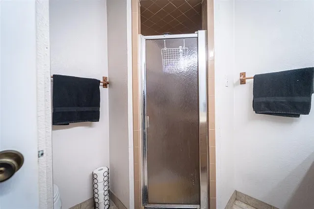 a view of a room with toys and wooden floor