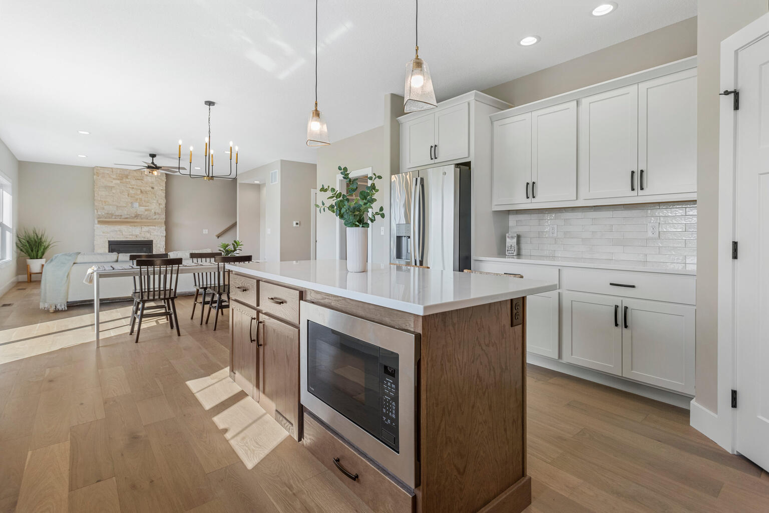 500 Prairie Meadows Drive Heyworth, IL 61745 - Photo 17 of 45 a kitchen with stainless steel appliances a stove a sink island and a wooden cabinets