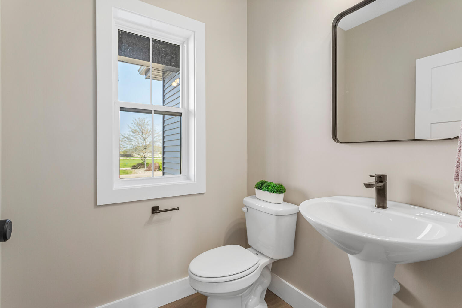 500 Prairie Meadows Drive Heyworth, IL 61745 - Photo 19 of 45 a bathroom with a toilet sink and mirror