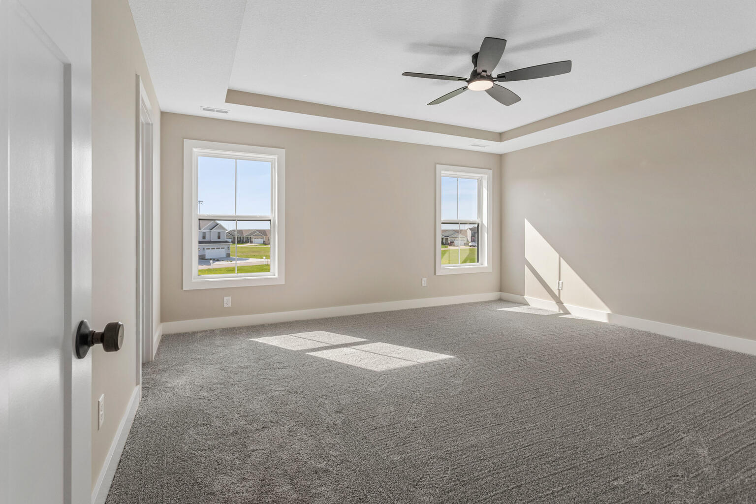500 Prairie Meadows Drive Heyworth, IL 61745 - Photo 23 of 45 a view of a livingroom with a ceiling fan and window