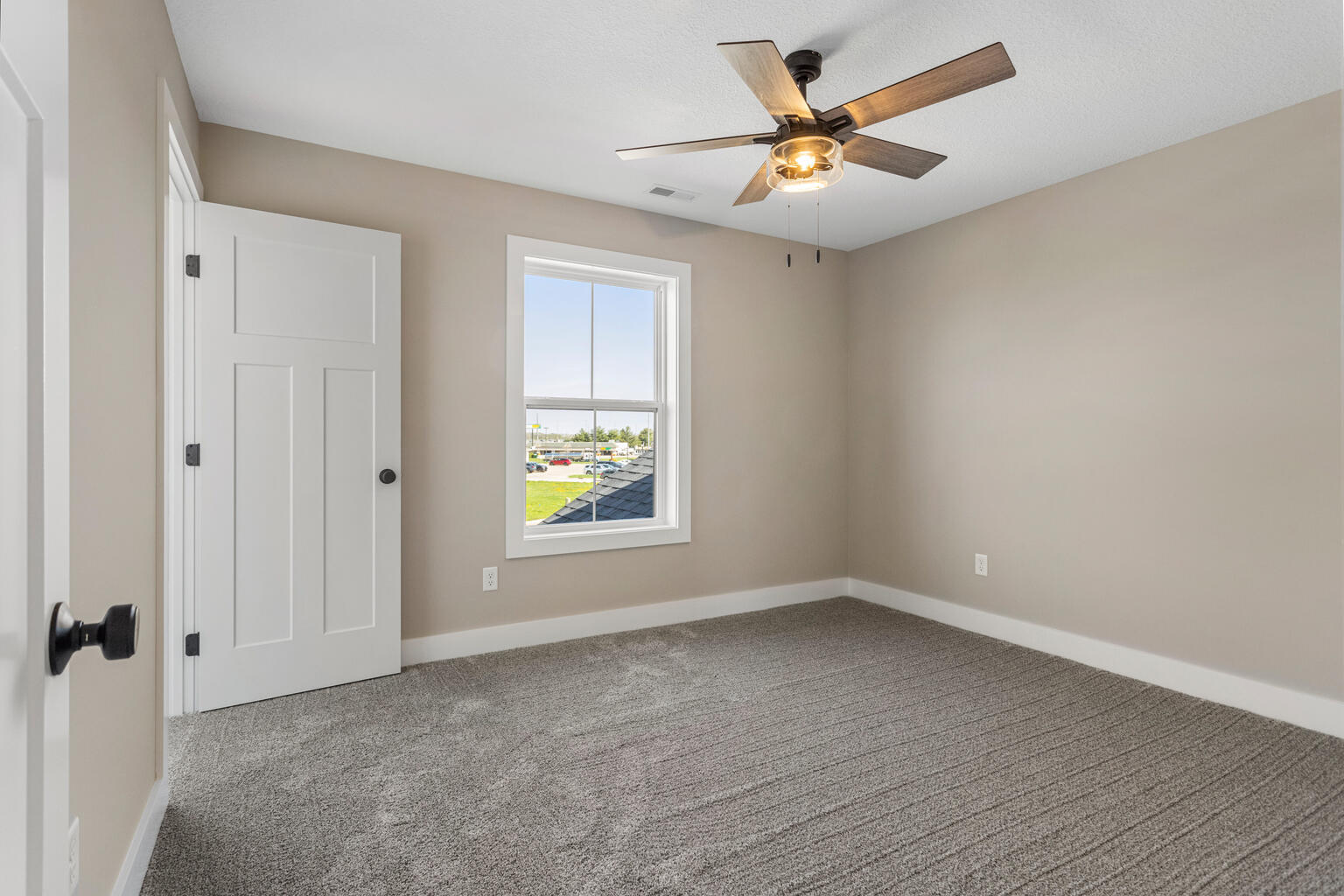 500 Prairie Meadows Drive Heyworth, IL 61745 - Photo 28 of 45 wooden floor in an empty room with a window