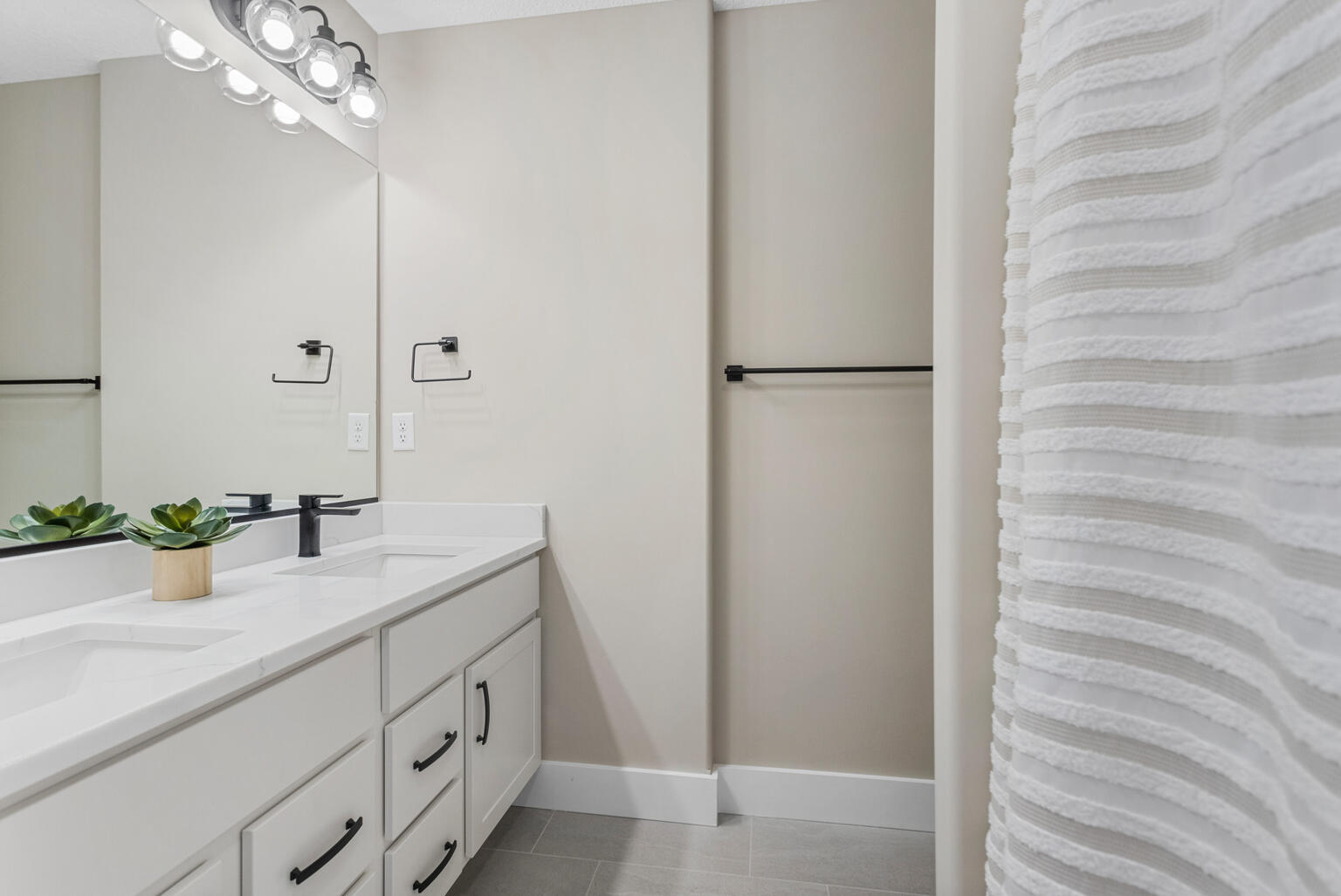 500 Prairie Meadows Drive Heyworth, IL 61745 - Photo 34 of 45 a bathroom with a sink a large mirror and shower