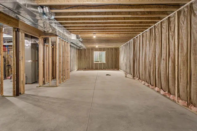a view of an empty room with wooden walls