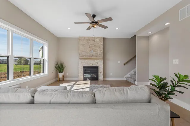 a living room with furniture and a fireplace