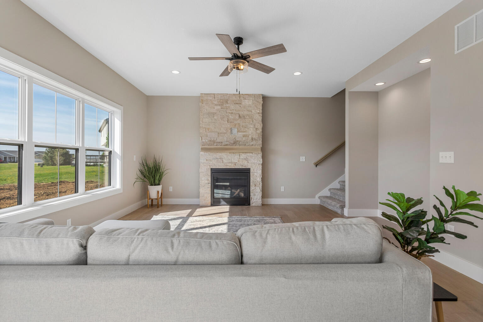 500 Prairie Meadows Drive Heyworth, IL 61745 - Photo 9 of 45 a living room with furniture and a fireplace