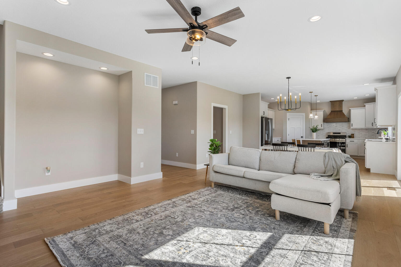 500 Prairie Meadows Drive Heyworth, IL 61745 - Photo 10 of 45 a living room with furniture and a chandelier