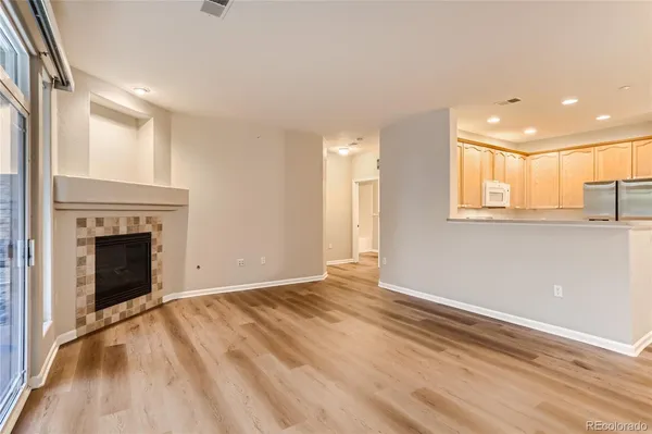 a kitchen with stainless steel appliances white cabinets and a stove top oven