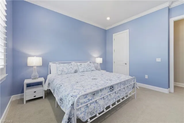 a bedroom with a bed and a lamp