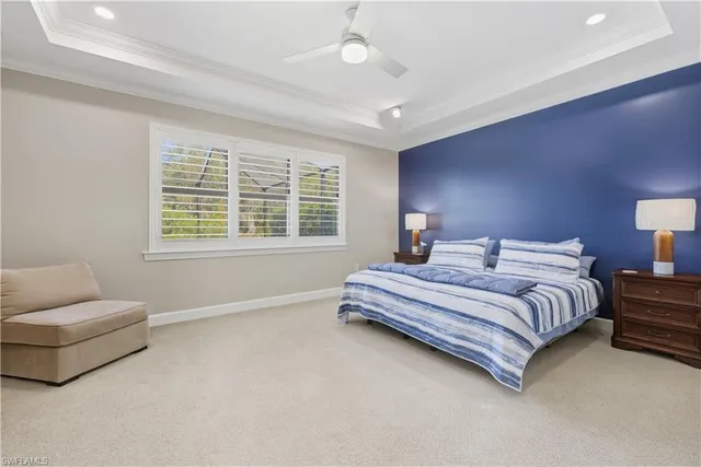 a spacious bedroom with a bed and a couch