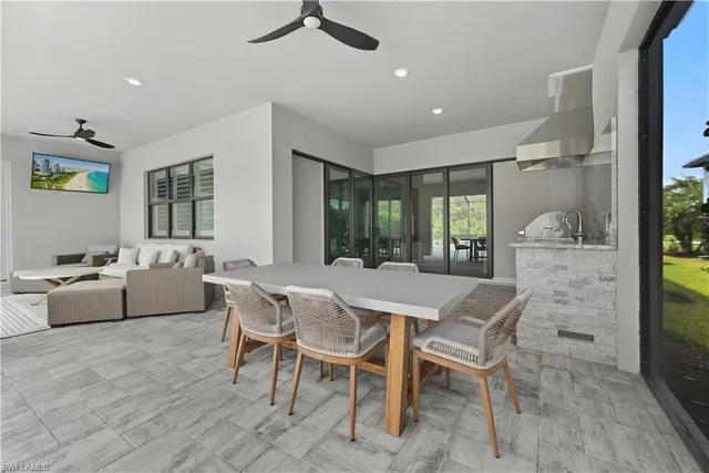 a dining room with furniture and window