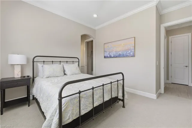 a bedroom with a bed and lamp