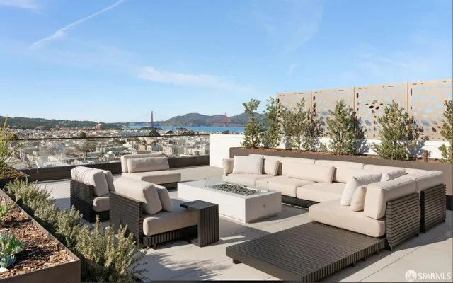a view of a balcony with furniture