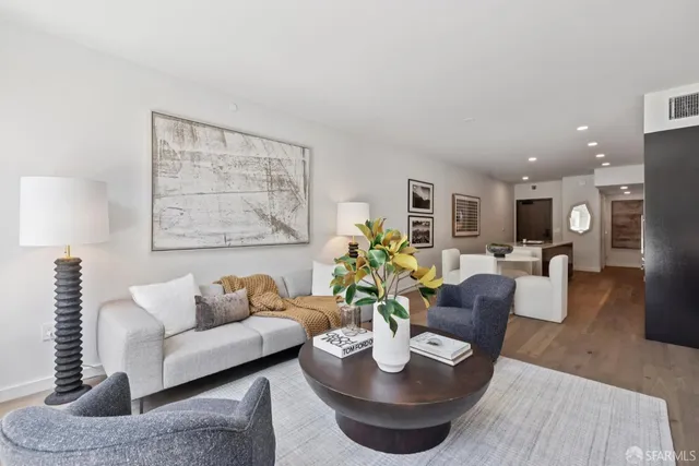 a living room with furniture and a table