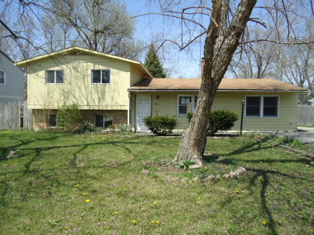 550 Redwood Road Bolingbrook, IL 60440 - Photo 1 of 14 a front view of a house with a yard